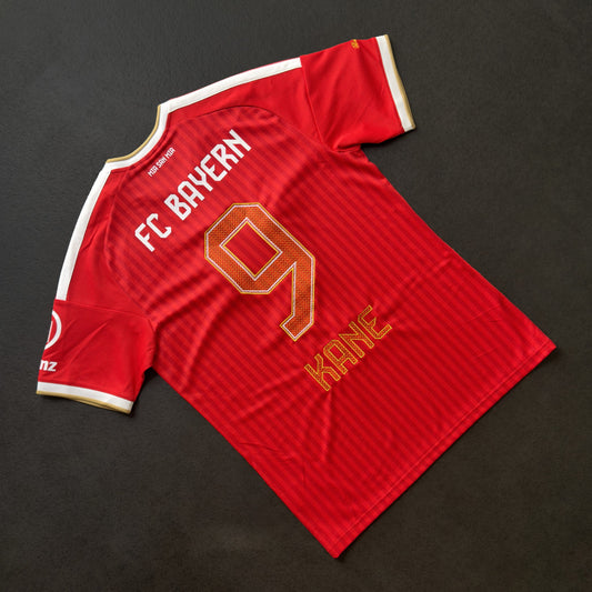 Bayern Munich 26/27 home jersey with Harry Kane's 9 and nameset embroidered in gold, back view