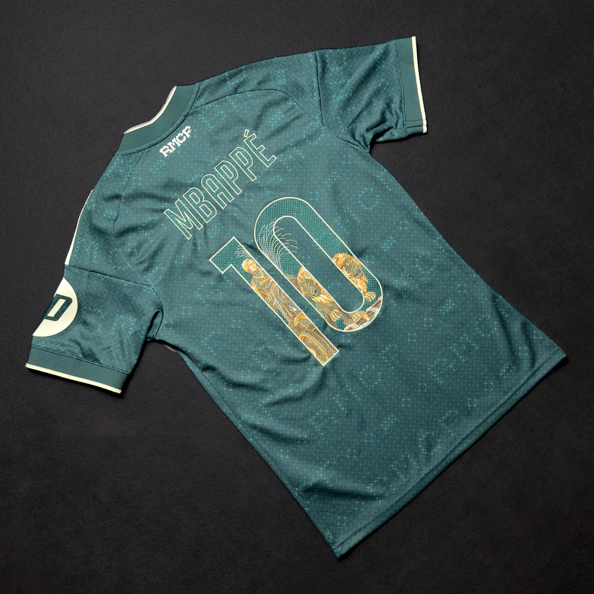 Back of the green Real Madrid away jersey with Mbappé and the number 10 embroidered with the Cibeles Fountain in stone and gold