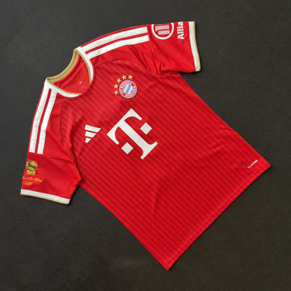Front of the Bayern Munich home jersey with the gold Ballon d'Or sleeve patch