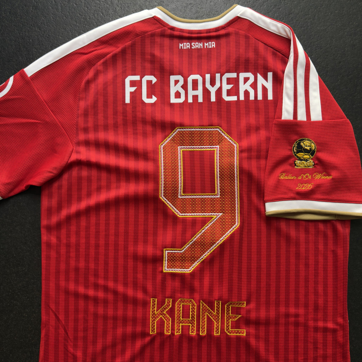 Back of the Kane Ballon d'Or home jersey showing the gold 9, KANE nameset and sleeve patch