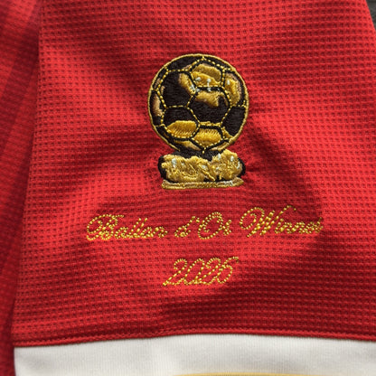 Close-up of the embroidered gold Ballon d'Or trophy patch with Ballon d'Or Winner 2026 in script