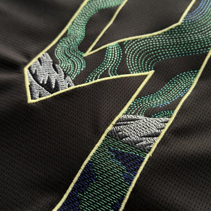 Close-up of the aurora running stitch and satin-stitched mountains on the Haaland 9
