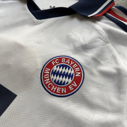 FC Bayern crest on the front of the white Bayern Munich away jersey