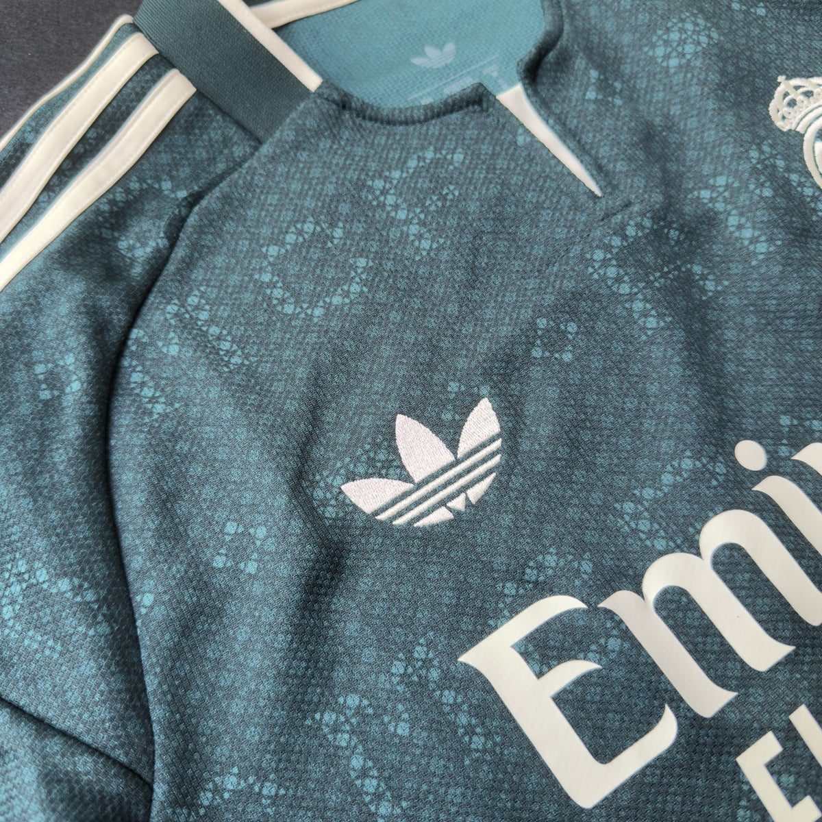 adidas trefoil, cream stripes and collar on the Real Madrid jersey