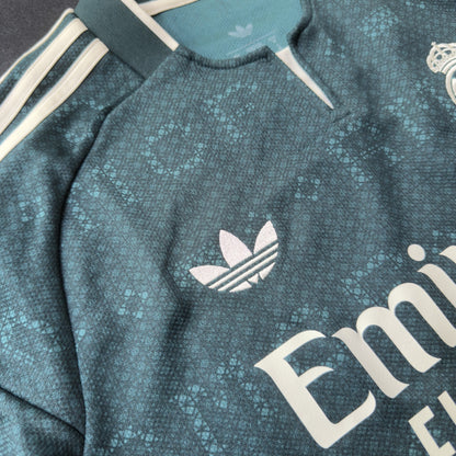 adidas trefoil, cream stripes and collar on the Real Madrid jersey