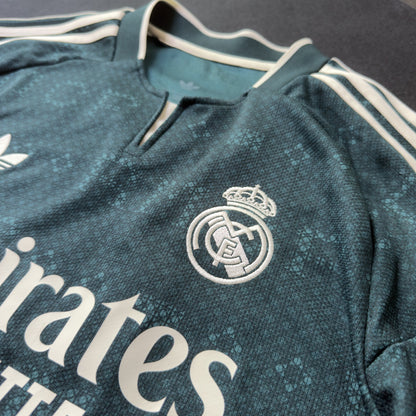 Real Madrid crest and Emirates sponsor on the front of the jersey