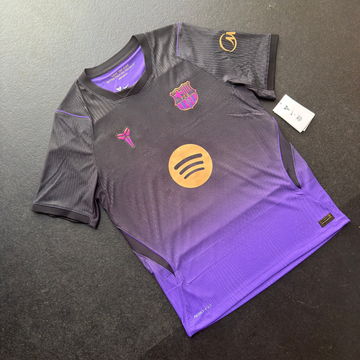 Front of the genuine Nike Barcelona 26/27 away jersey, a black to purple fade with the Mamba logo on the chest