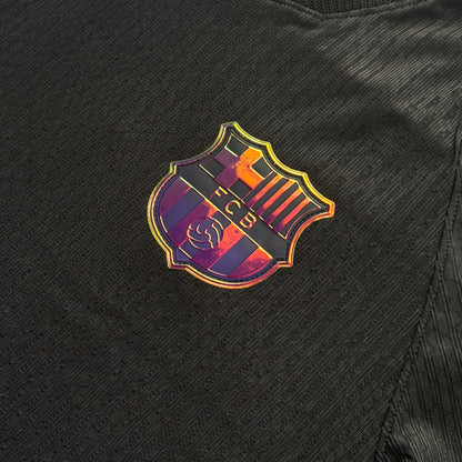 Iridescent Barcelona crest on the front of the away jersey