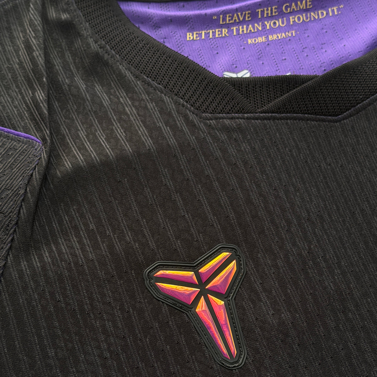 Mamba logo on the chest, with Kobe Bryant's 'Leave the game better than you found it' printed inside the collar